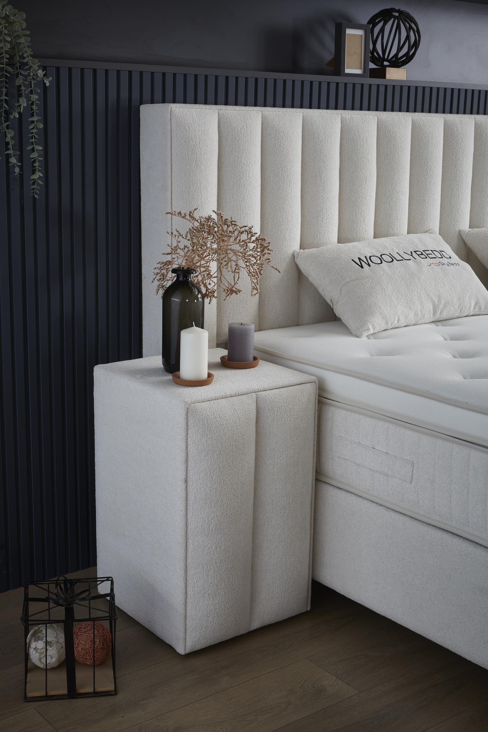 Boxspringbett 'WoollyBedd' mit integrierter Matratze und Stauraum, abgebildet bei SkyHome24.de, ideal für günstigen, komfortablen Schlaf, einschließlich innovativer Pro Balance-Federtechnologie.