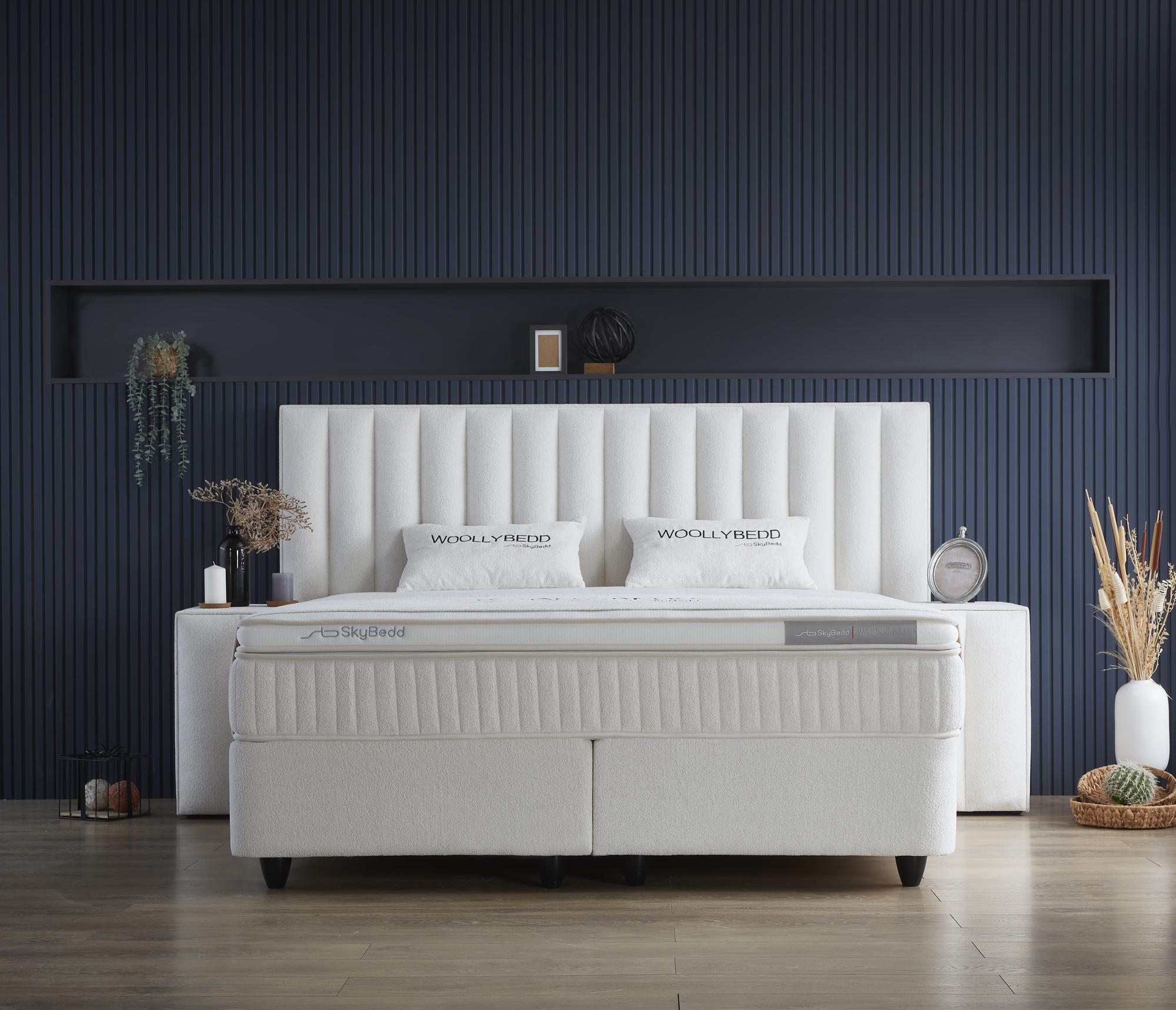 Boxspringbett 'WoollyBedd' von SkyBedd in Hellbeige/Elfenbein mit integrierter Matratze und Stauraum, ideal für modernen Schlafkomfort, erhältlich bei SkyHome24.de zu günstigen Preisen.