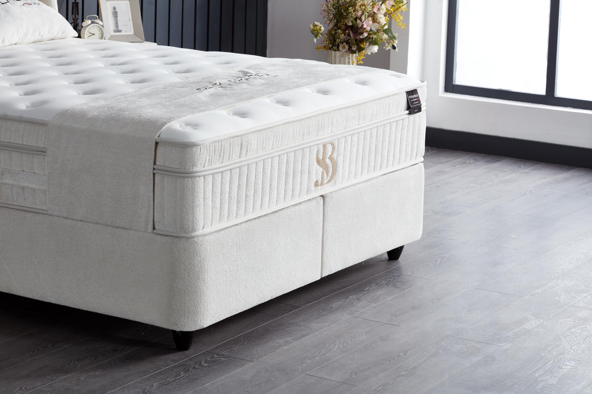 Boxspringbett 'PerlaBedd' mit Stauraum und Matratze von SkyHome24.de, ideal für modernen, günstigen Schlafkomfort und zusätzlichen Stauraum.